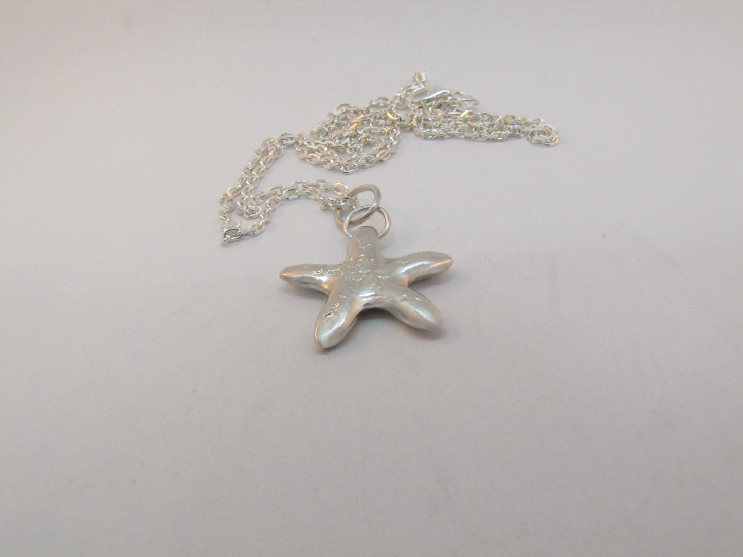 COLLIER PENDENTIF ÉTOILE ÉTOILÉE
